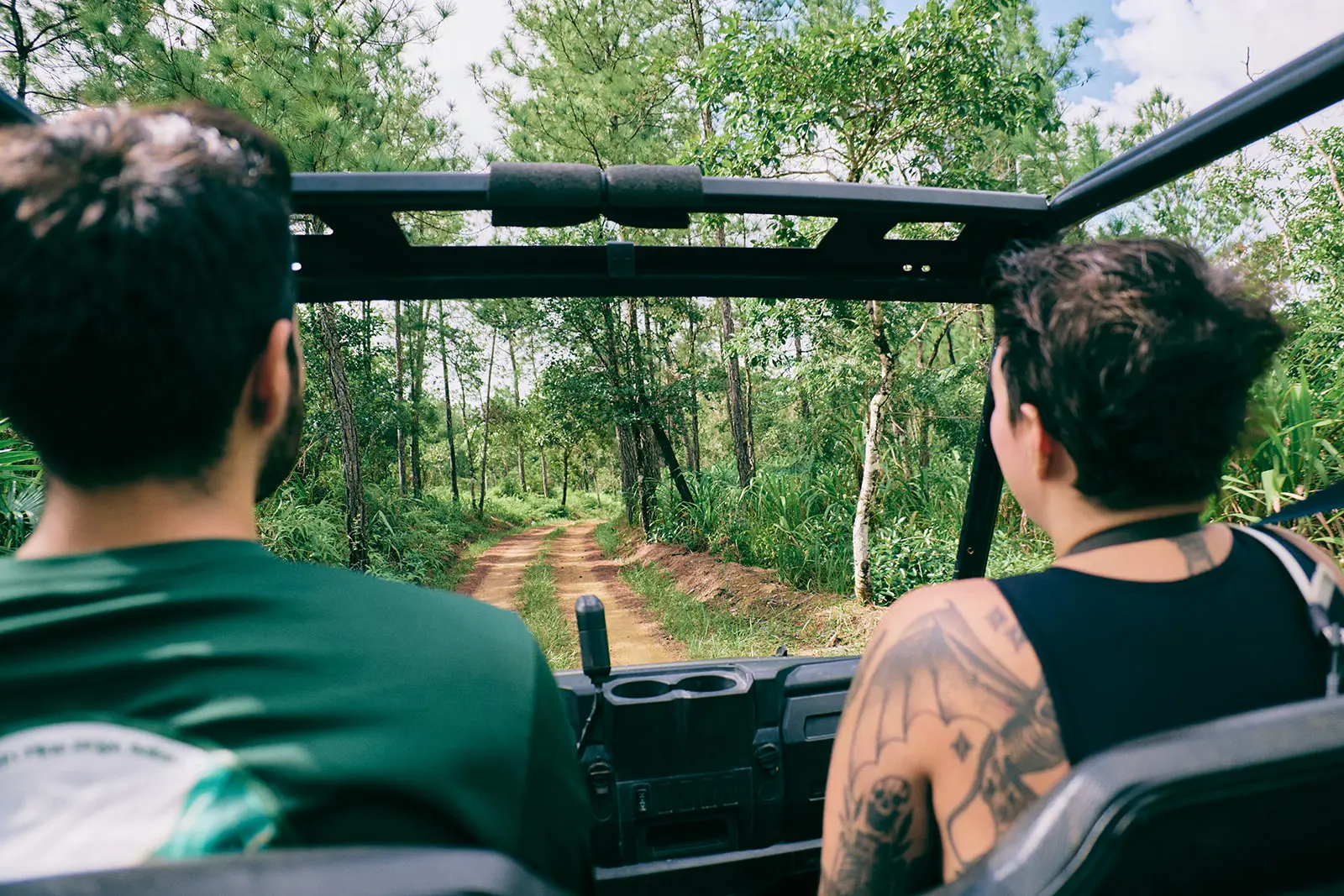 tatooed woman in atv at belize jungle lodge